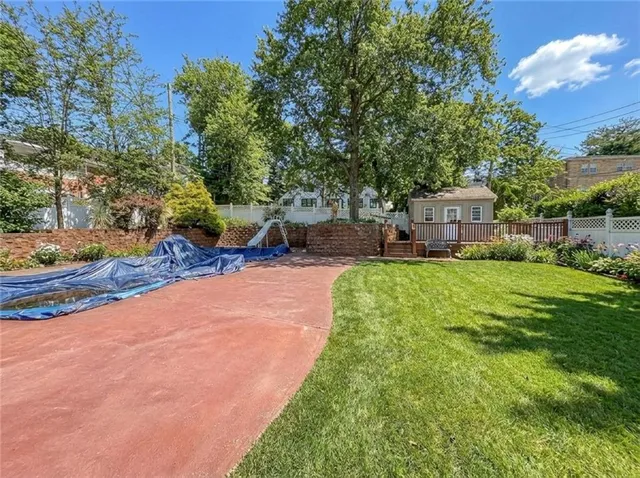 a view of a house with a yard porch and sitting area