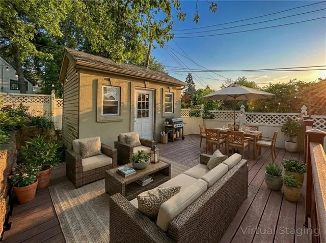 a view of a patio with couches and potted plants
