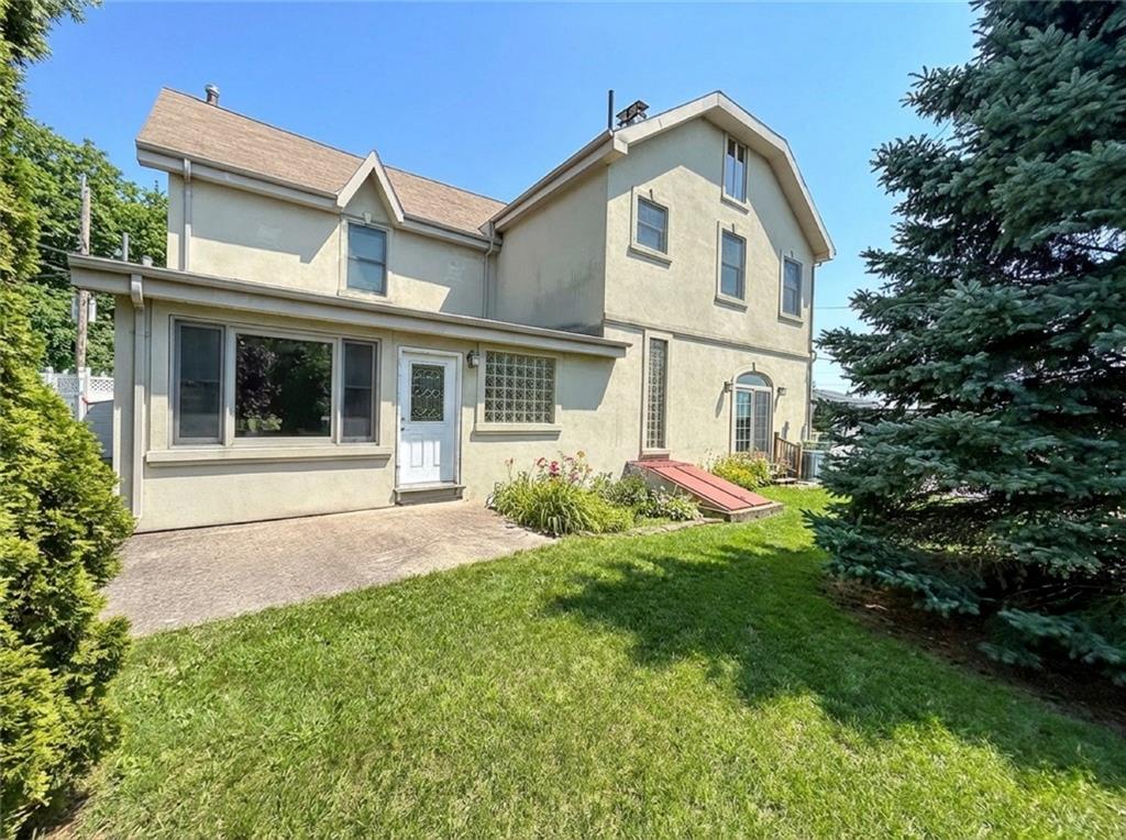 39 Hasbrouk Road Staten Island, NY 10304 - Photo 47 of 50 a front view of a house with a garden and yard