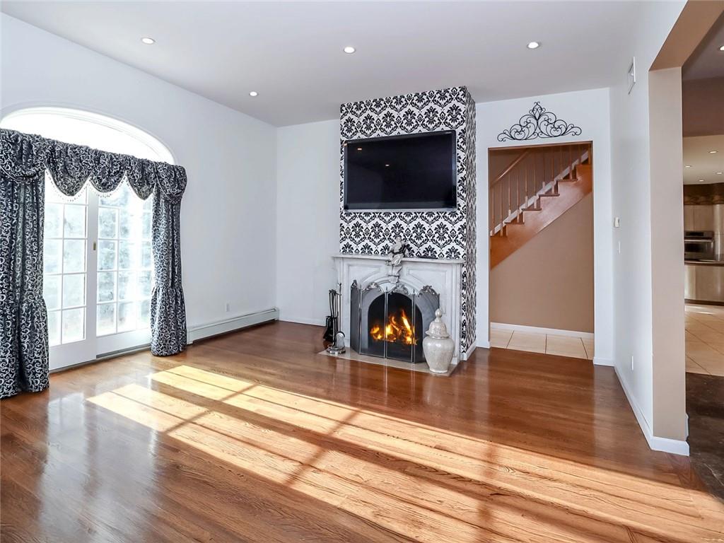 39 Hasbrouk Road Staten Island, NY 10304 - Photo 7 of 50 a living room with furniture and a fireplace