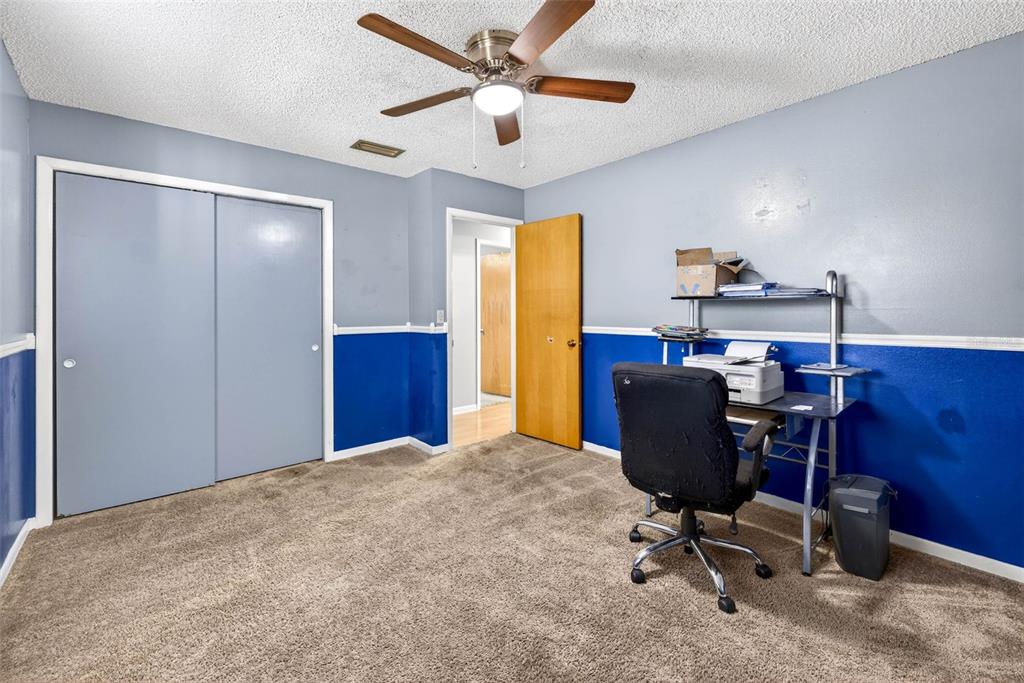 619 Limona Road Brandon, FL 33510 - Photo 22 of 32 a view of a workspace with furniture and a window