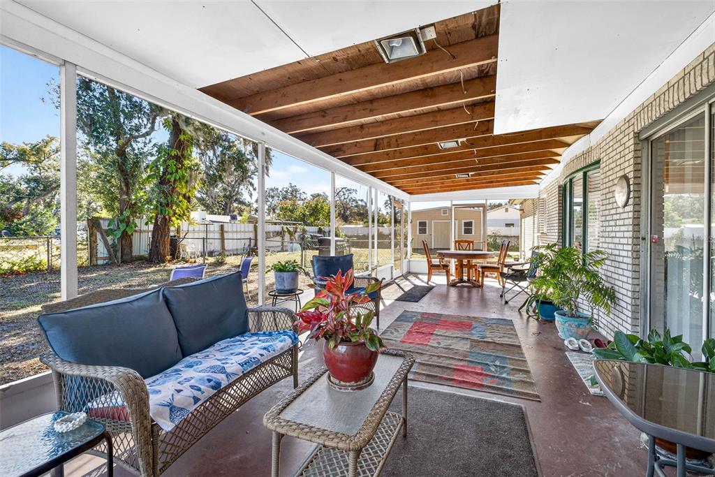 619 Limona Road Brandon, FL 33510 - Photo 27 of 32 a outdoor space with patio the couches and chairs with potted plants