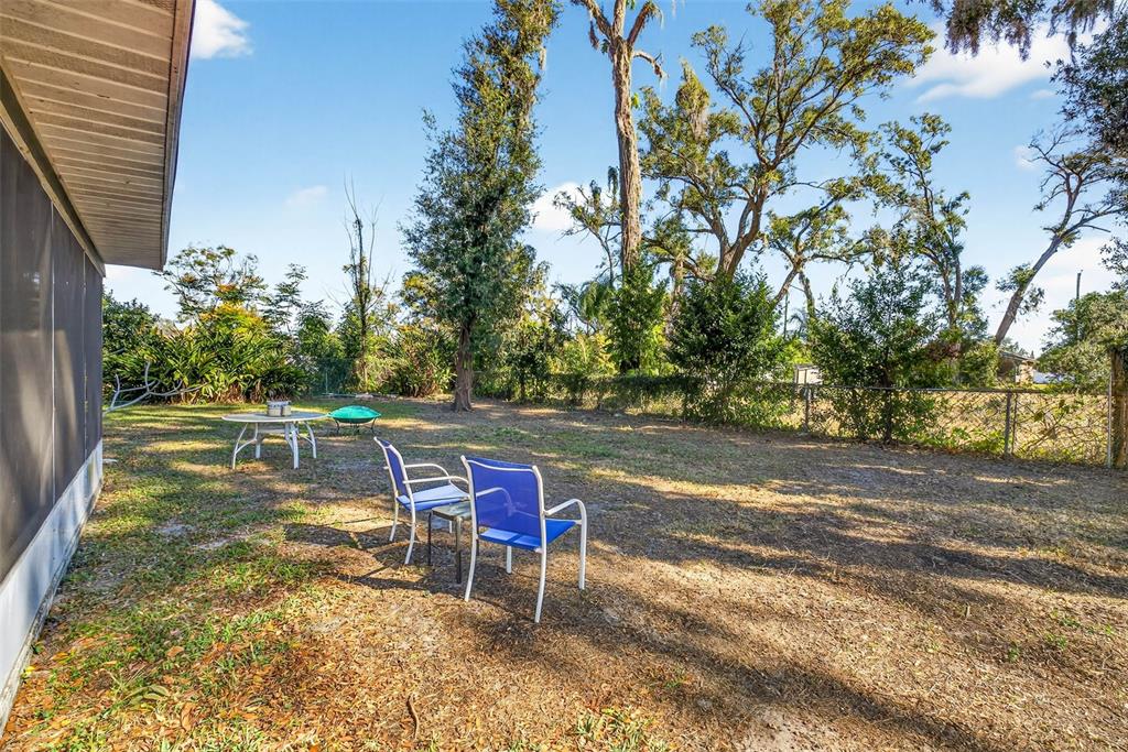 619 Limona Road Brandon, FL 33510 - Photo 28 of 32 a view of a yard with table and chairs