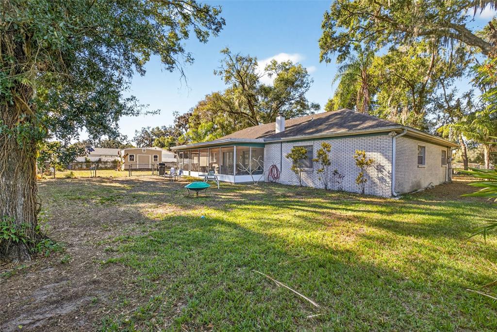 619 Limona Road Brandon, FL 33510 - Photo 31 of 32 a front view of house with yard and seating area