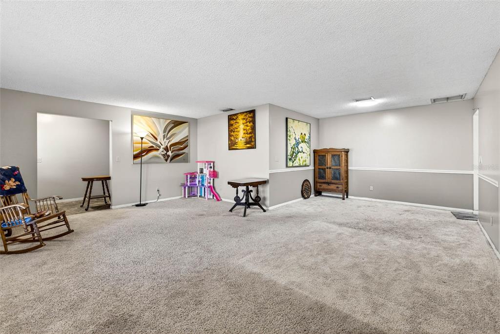 619 Limona Road Brandon, FL 33510 - Photo 8 of 32 a view of a livingroom with workspace and a window