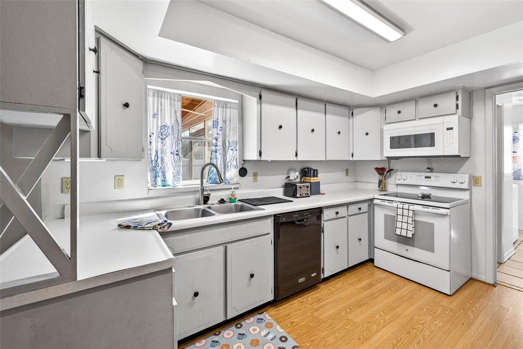 619 Limona Road Brandon, FL 33510 - Photo 10 of 32 a kitchen with a sink window and cabinets
