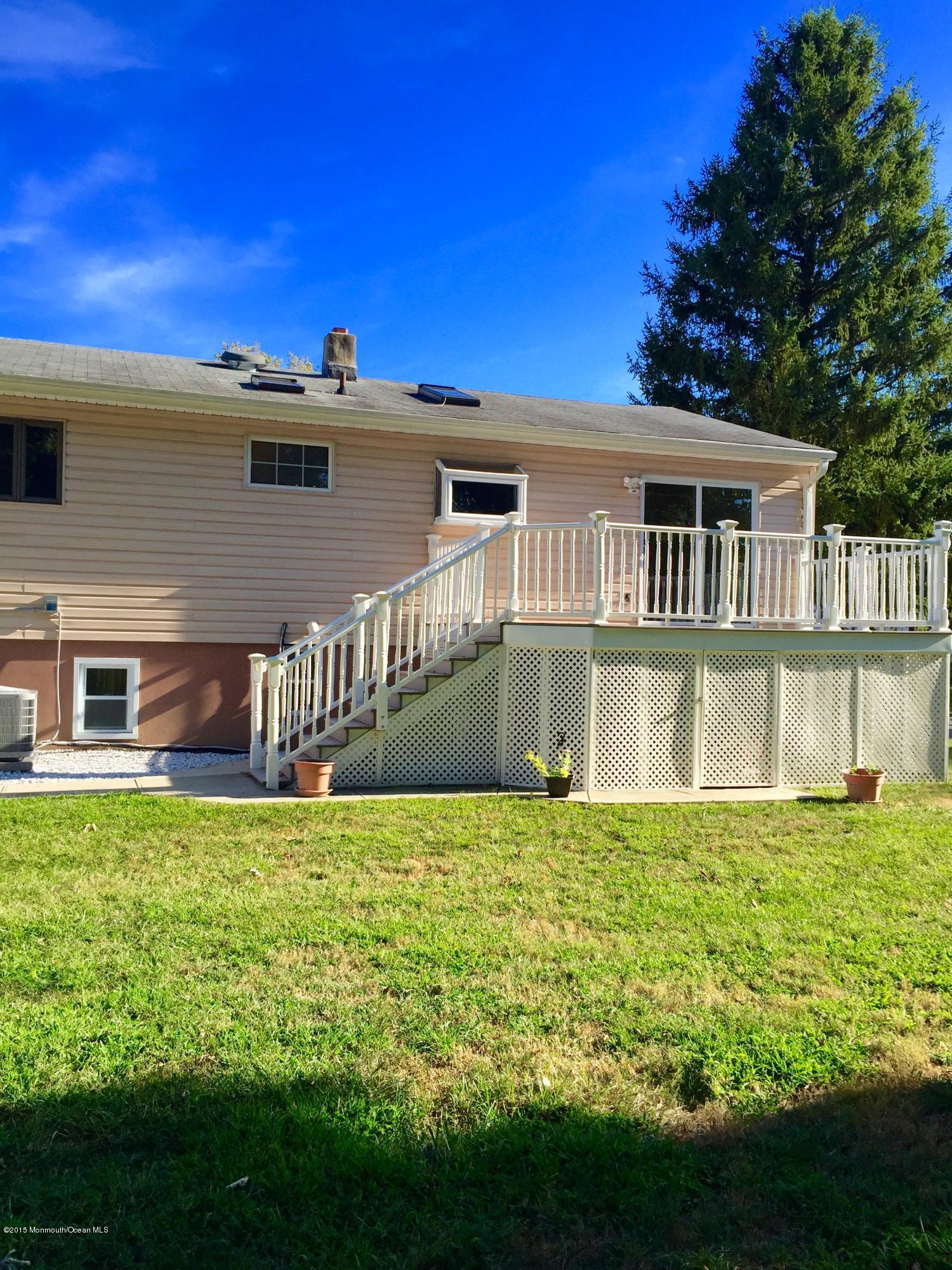 1 Alfred Court Neptune Township, NJ 07753 - Photo 12 of 26 a view of a house with a yard