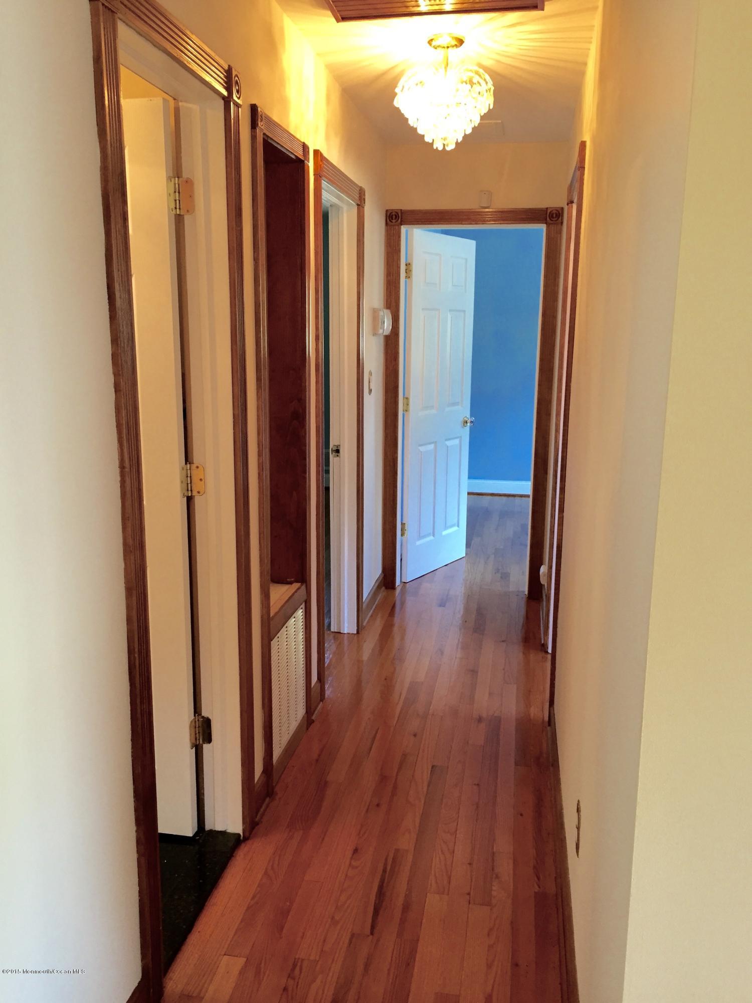 1 Alfred Court Neptune Township, NJ 07753 - Photo 15 of 26 a view of a hallway with wooden floor