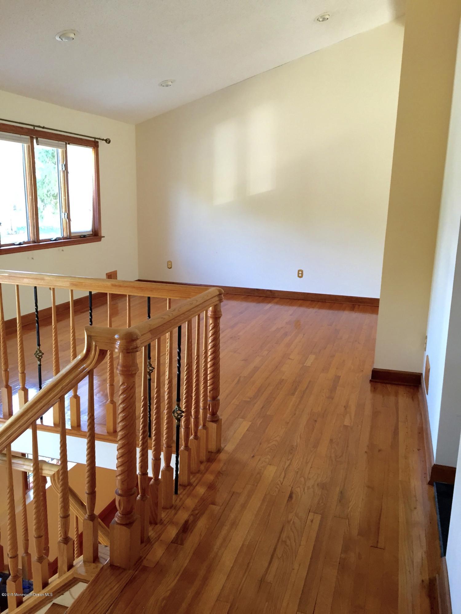 1 Alfred Court Neptune Township, NJ 07753 - Photo 2 of 26 a view of a hallway with wooden floor