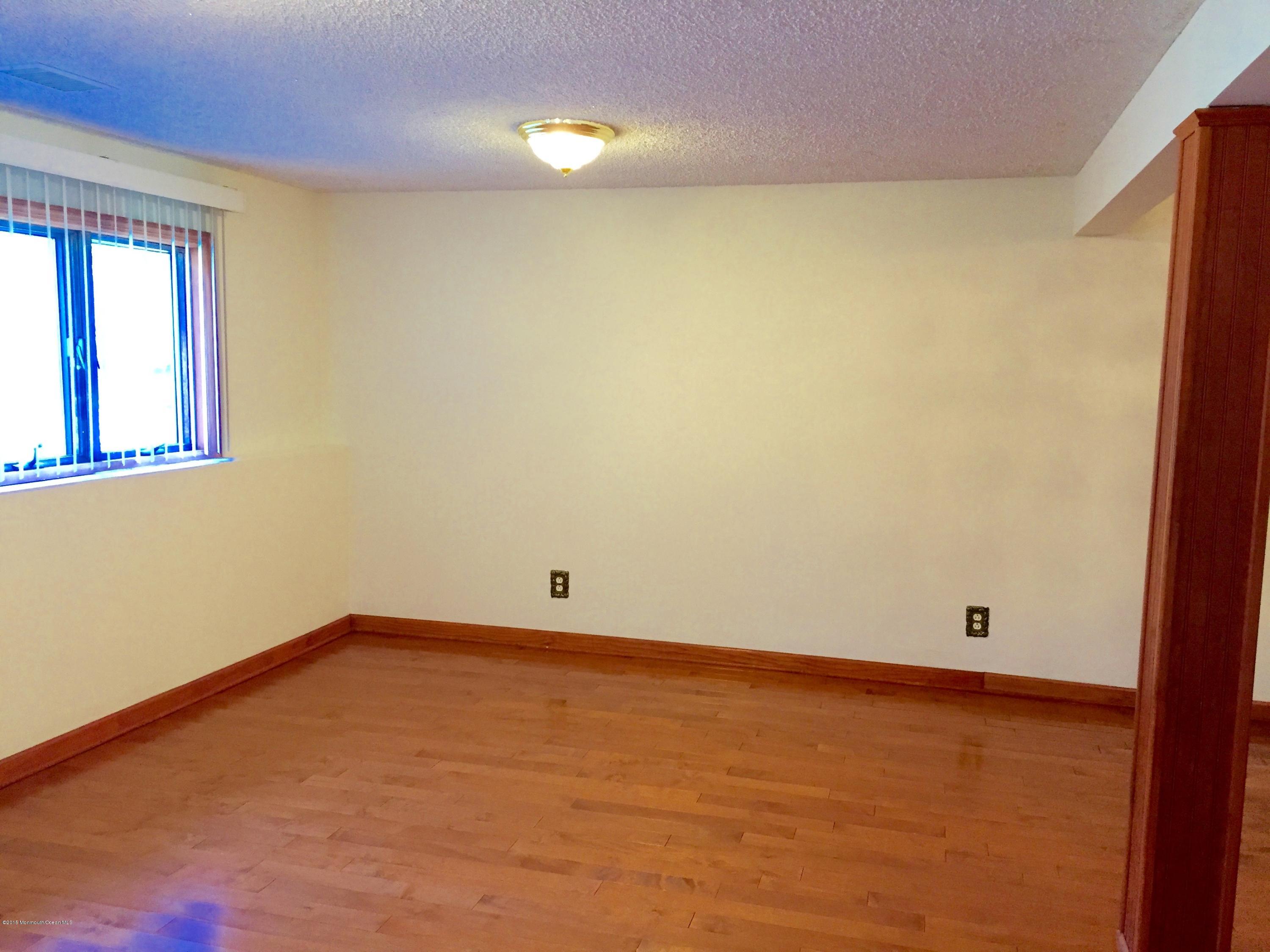 1 Alfred Court Neptune Township, NJ 07753 - Photo 25 of 26 a view of an empty room with a window