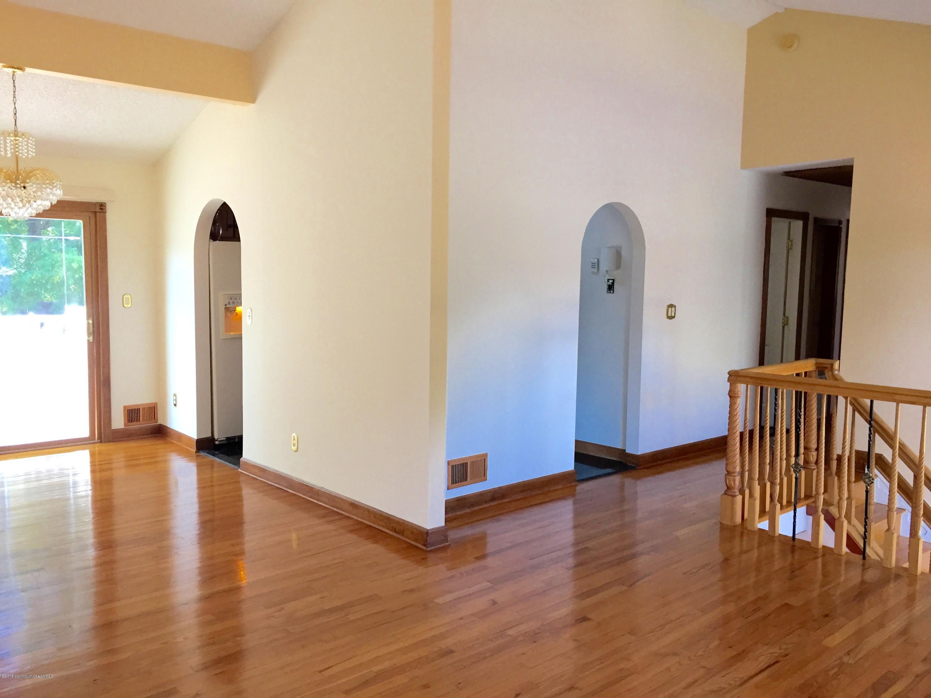 1 Alfred Court Neptune Township, NJ 07753 - Photo 3 of 26 a view of empty room with wooden floor and window