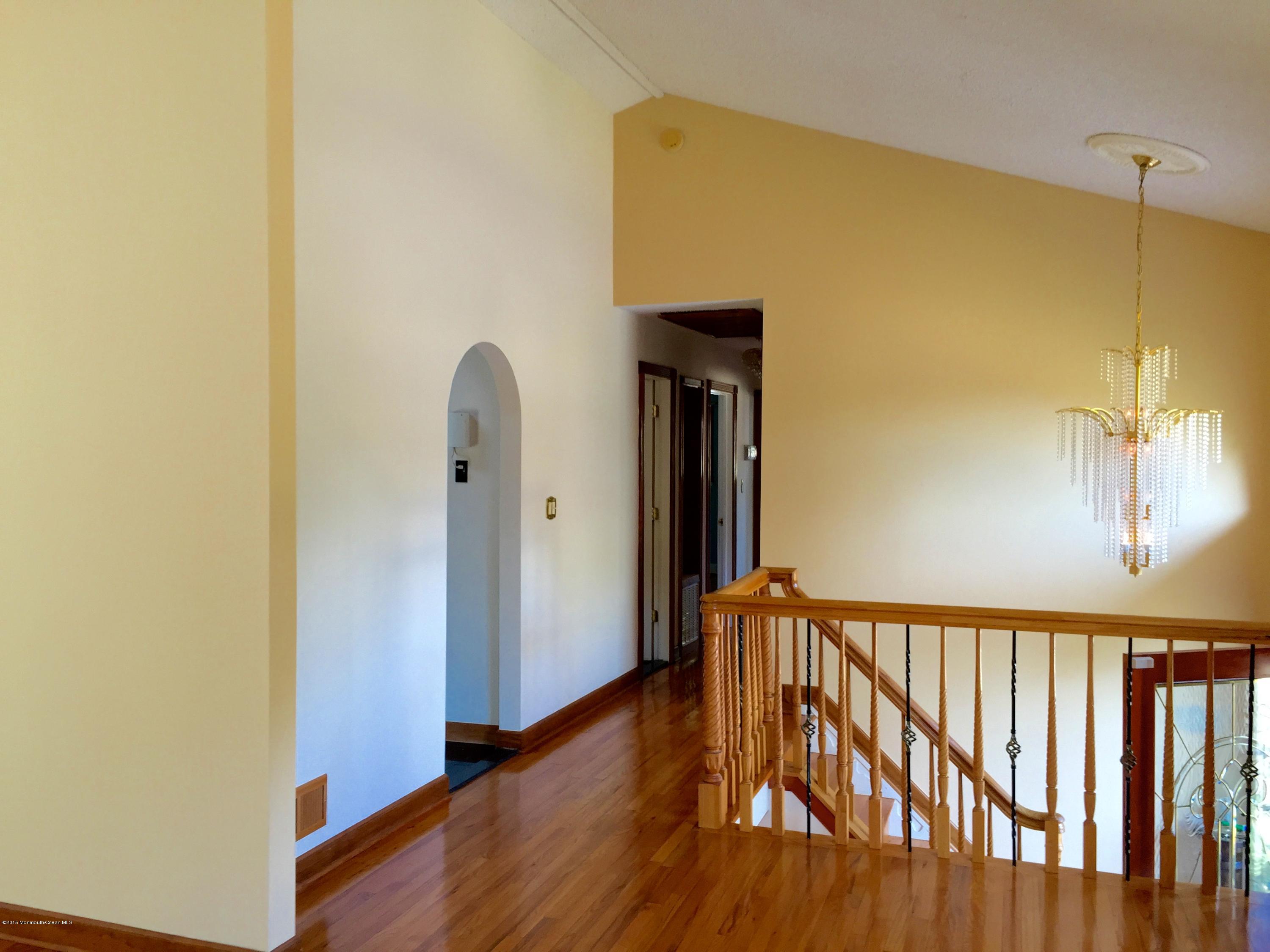 1 Alfred Court Neptune Township, NJ 07753 - Photo 4 of 26 a view of a hallway with wooden floor