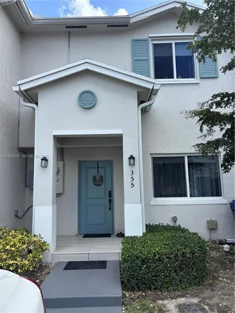 a front view of a house with a garage