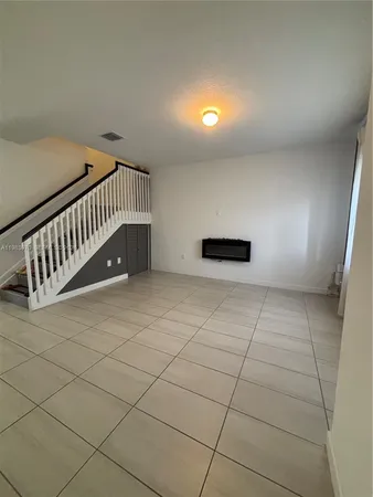a view of staircase with white walls