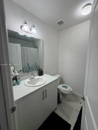 a bathroom with a shower and a sink