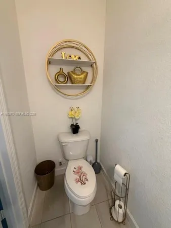 a bathroom with a toilet and a sink