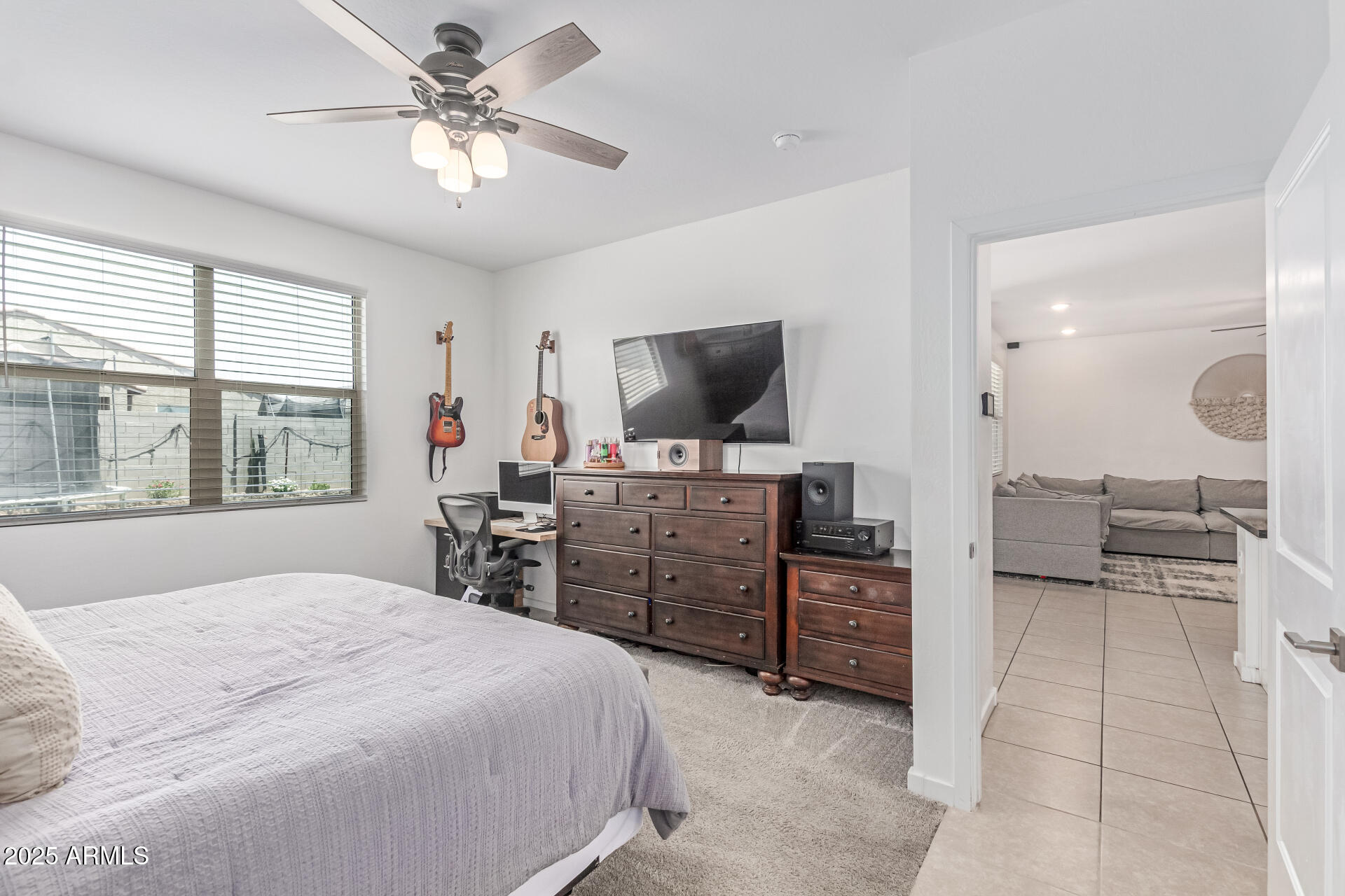 37287 North Azteca Road San Tan Valley, AZ 85140 - Photo 15 of 37 a bedroom with a bed and a flat screen tv