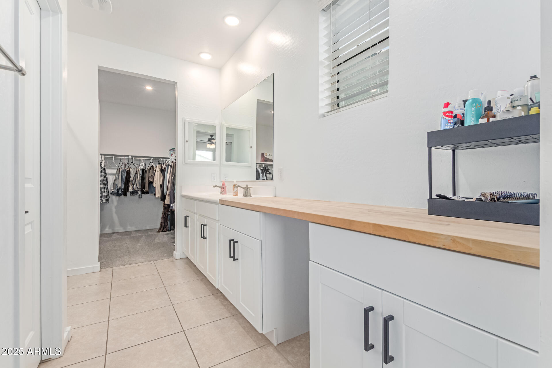 37287 North Azteca Road San Tan Valley, AZ 85140 - Photo 17 of 37 a spacious bathroom with a sink and a mirror