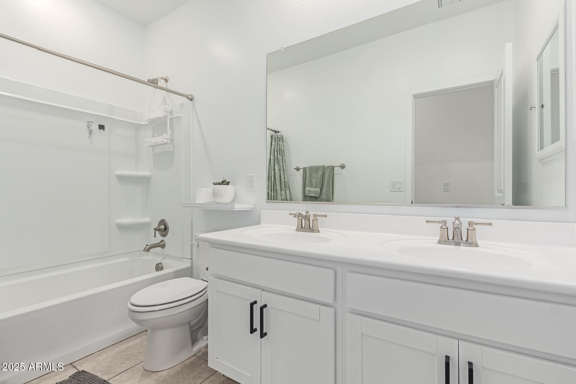 37287 North Azteca Road San Tan Valley, AZ 85140 - Photo 24 of 37 a bathroom with a toilet a sink a mirror a bathtub and vanity