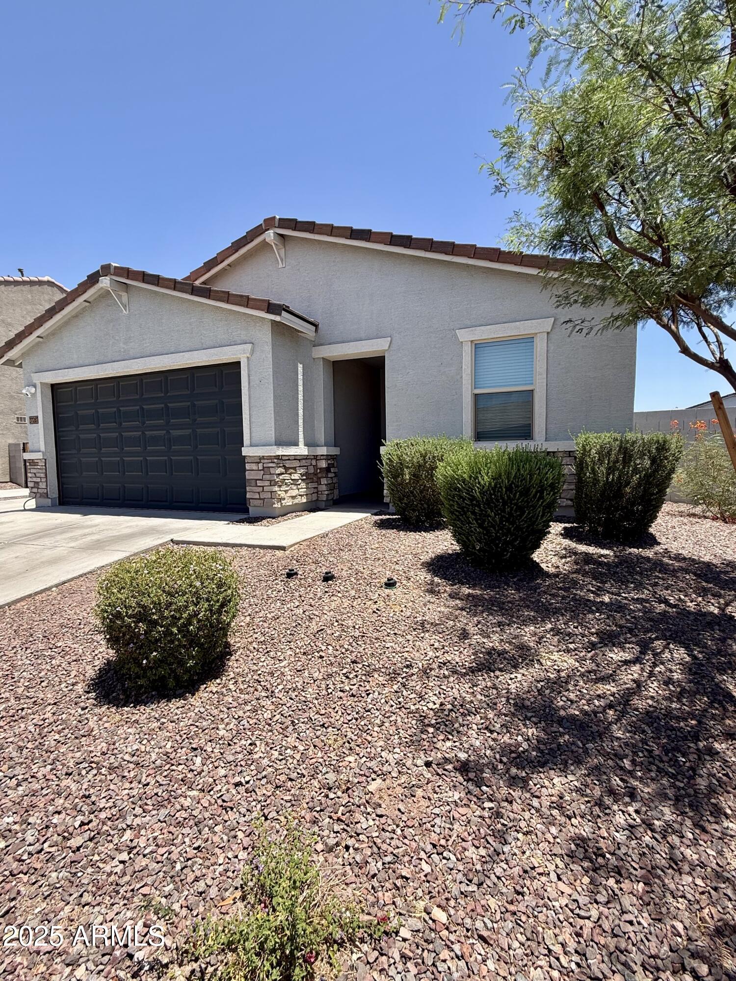 37287 North Azteca Road San Tan Valley, AZ 85140 - Photo 34 of 37 a front view of a house with a yard
