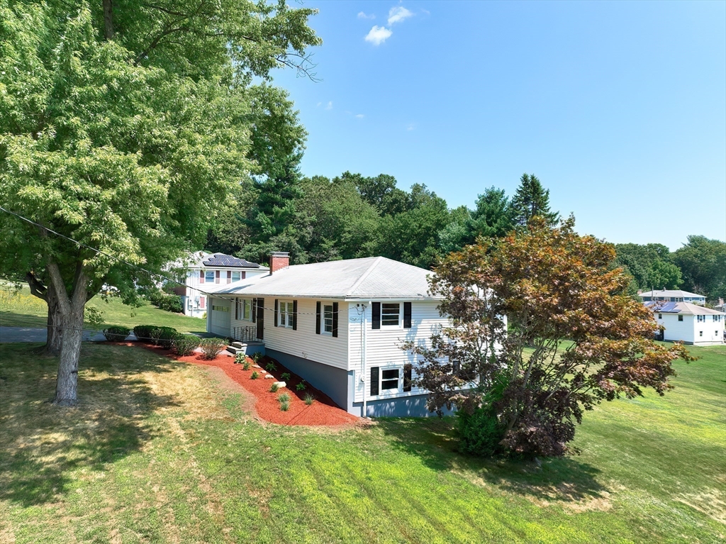 19 Ledgewood Road Framingham, MA 01701 - Photo 1 of 42 a view of a house with a big yard and large trees