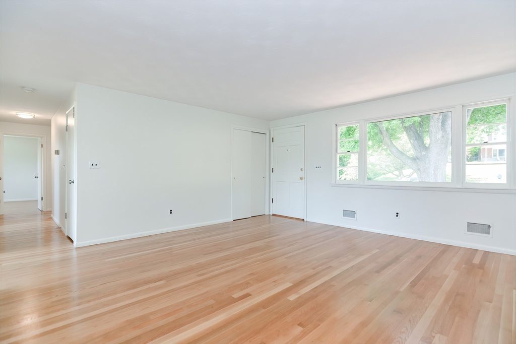 19 Ledgewood Road Framingham, MA 01701 - Photo 12 of 42 an empty room with wooden floor and windows