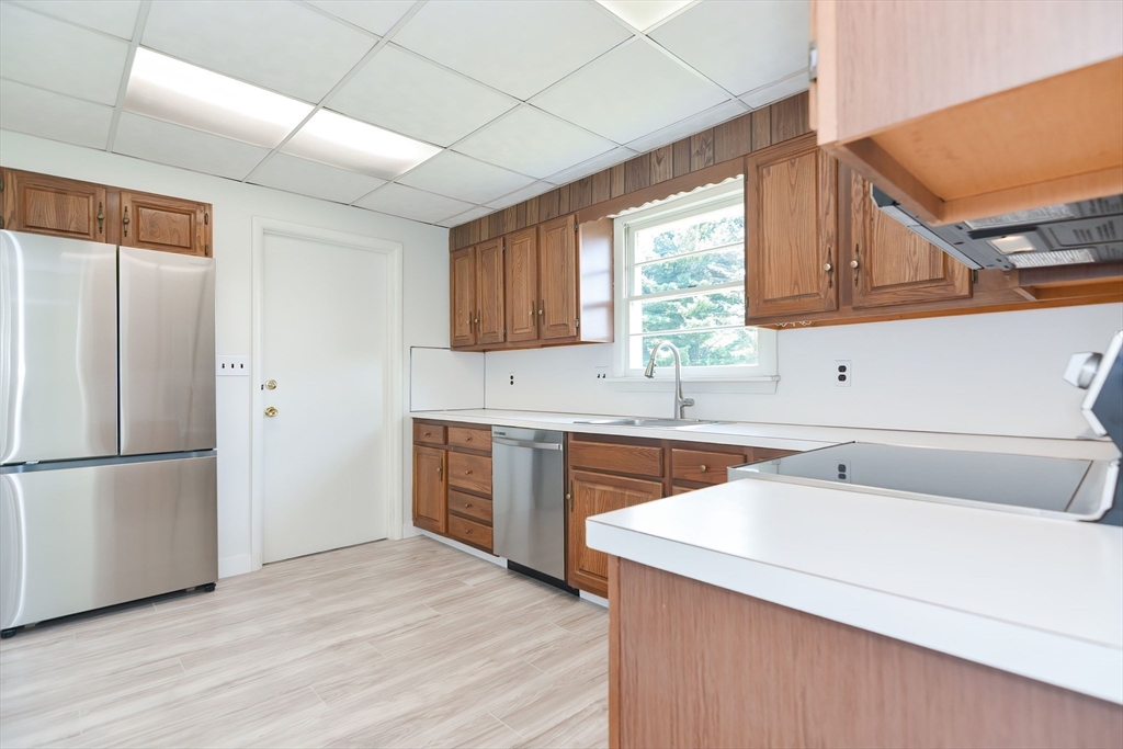 19 Ledgewood Road Framingham, MA 01701 - Photo 15 of 42 a kitchen with a refrigerator sink and cabinets