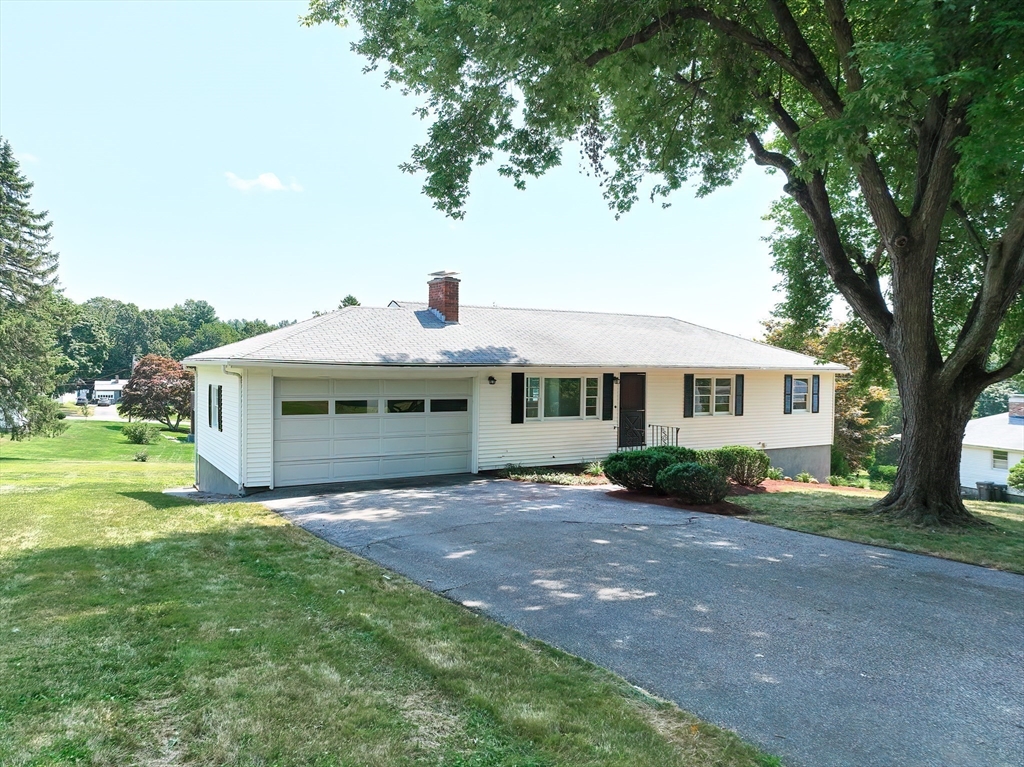 19 Ledgewood Road Framingham, MA 01701 - Photo 2 of 42 a front view of a house with a garden