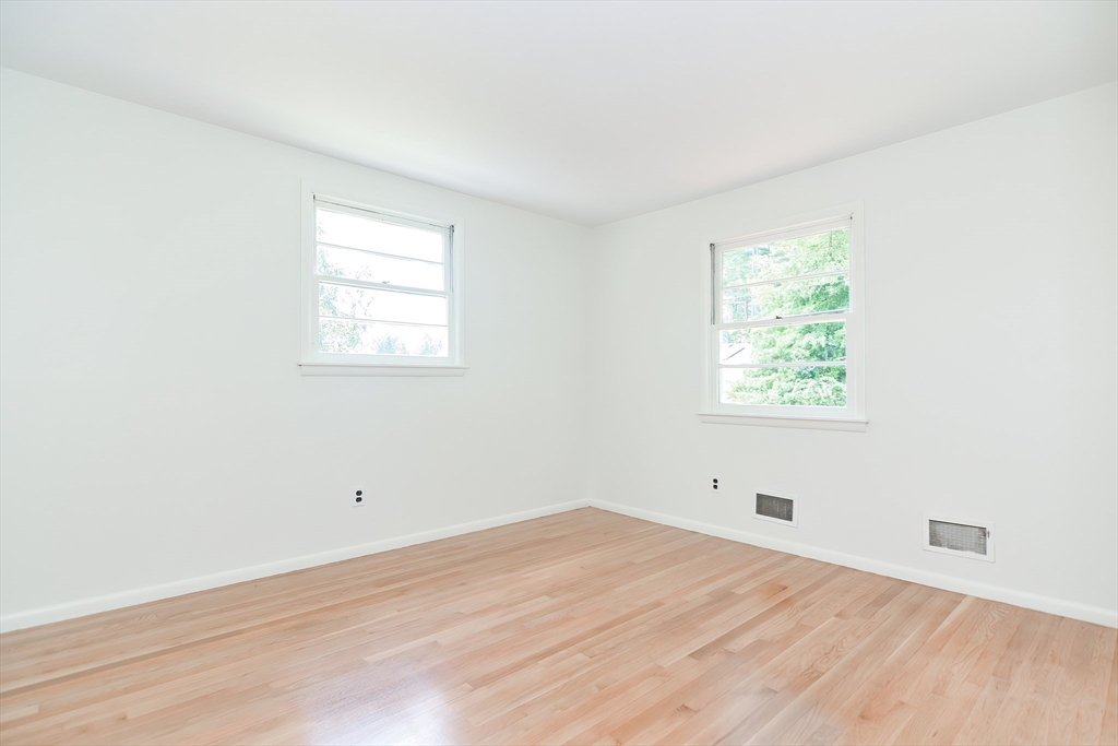 19 Ledgewood Road Framingham, MA 01701 - Photo 21 of 42 an empty room with wooden floor and windows