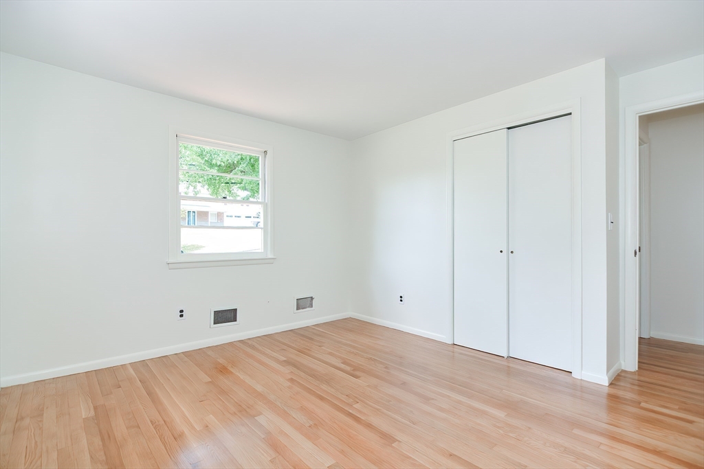 19 Ledgewood Road Framingham, MA 01701 - Photo 22 of 42 a view of an empty room with wooden floor and a window