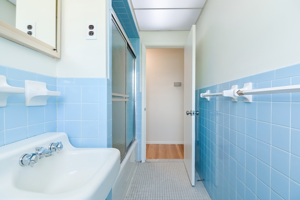 19 Ledgewood Road Framingham, MA 01701 - Photo 25 of 42 a bathroom with a sink and shower