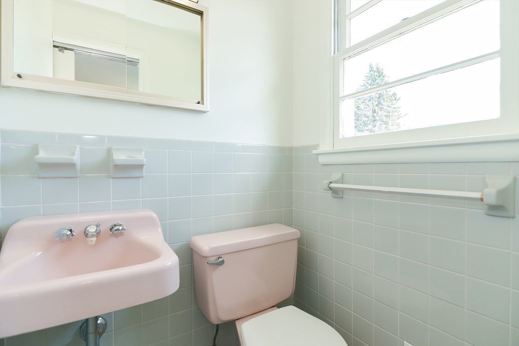 19 Ledgewood Road Framingham, MA 01701 - Photo 26 of 42 a white toilet sitting next to a bathroom sink