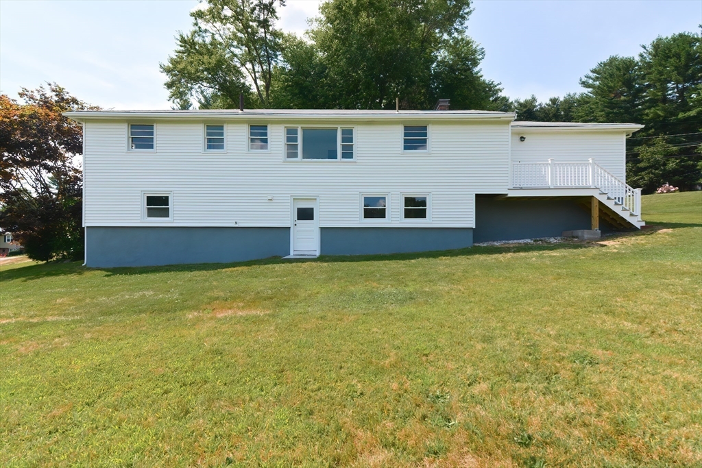 19 Ledgewood Road Framingham, MA 01701 - Photo 27 of 42 a view of a house with pool and a yard