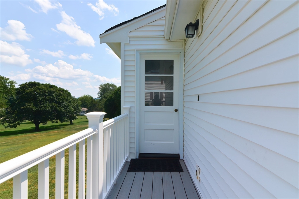 19 Ledgewood Road Framingham, MA 01701 - Photo 34 of 42 a view of a balcony with wooden floor and fence