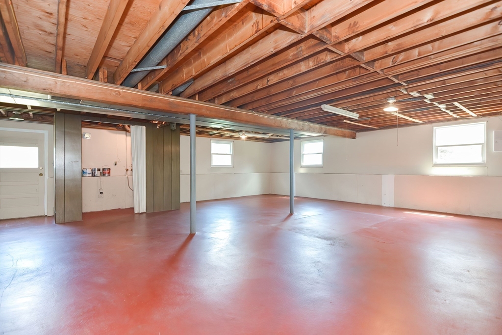 19 Ledgewood Road Framingham, MA 01701 - Photo 41 of 42 an empty room with wooden floor and windows