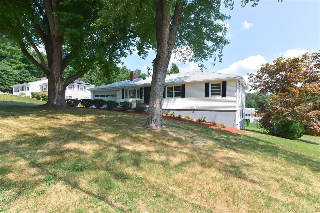 19 Ledgewood Road Framingham, MA 01701 - Photo 9 of 42 a front view of a house with garden