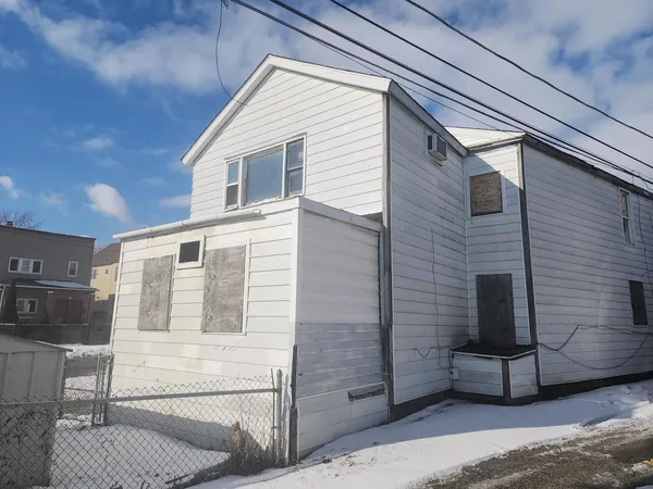a front view of a house with a garage