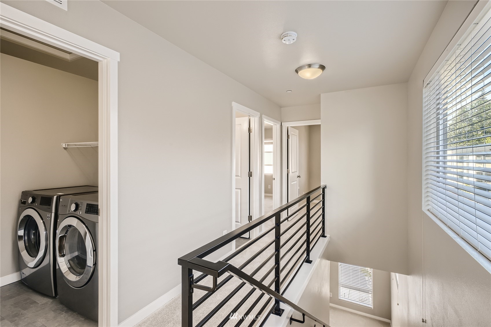 729 112th Street Southwest, Unit G1 Everett, WA 98204 - Photo 11 of 27 a view of a hallway with washer and dryer