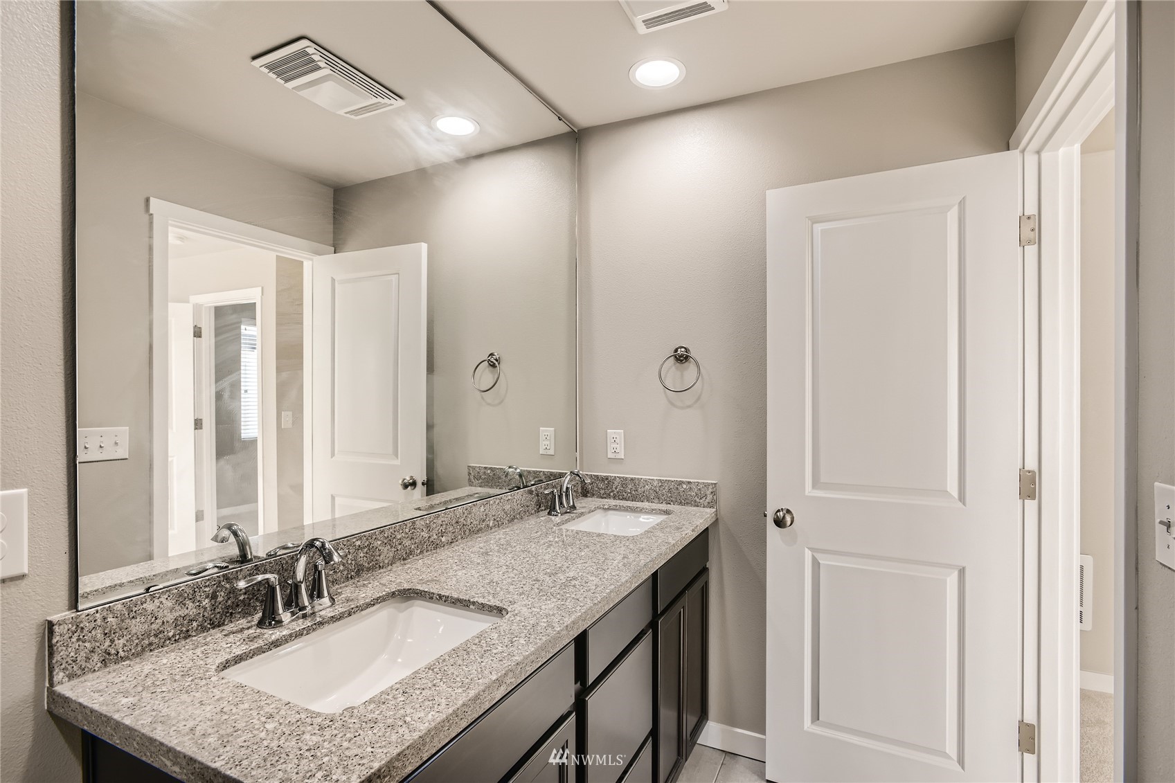 729 112th Street Southwest, Unit G1 Everett, WA 98204 - Photo 16 of 27 a bathroom with a granite countertop sink a mirror and a shower