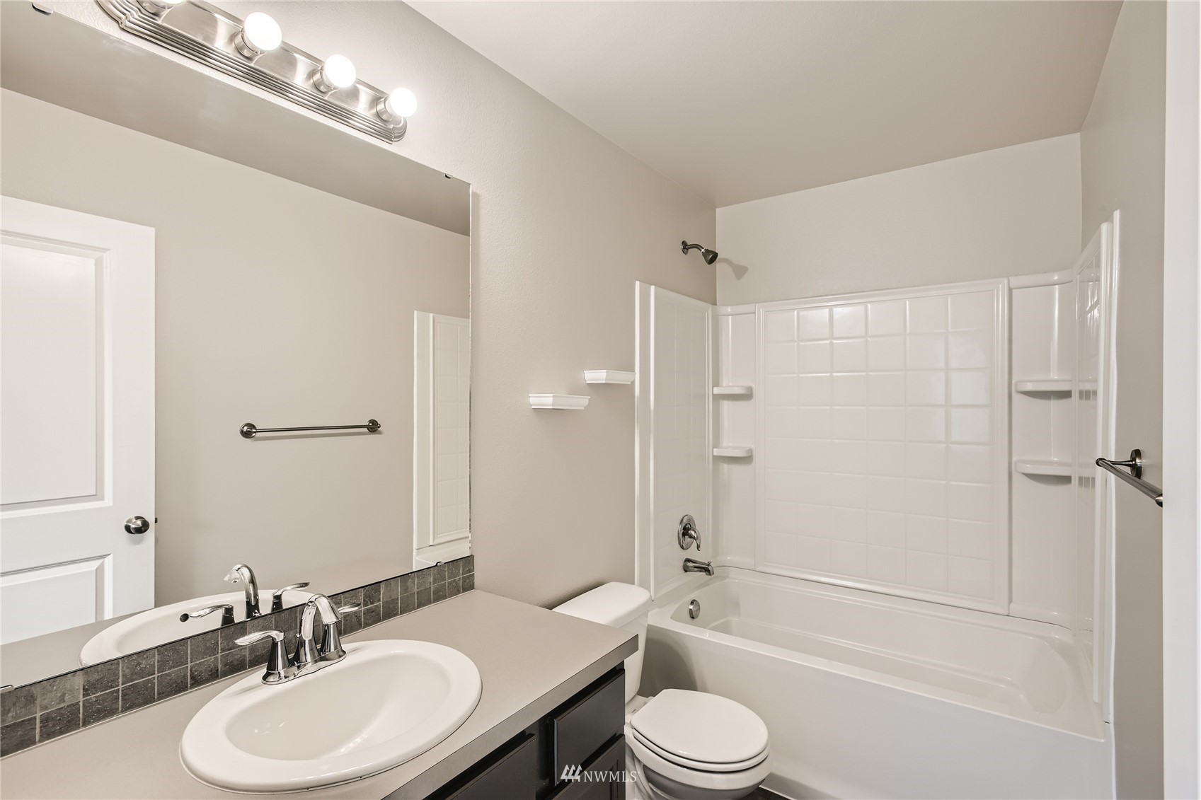 729 112th Street Southwest, Unit G1 Everett, WA 98204 - Photo 22 of 27 a bathroom with a sink a toilet and shower