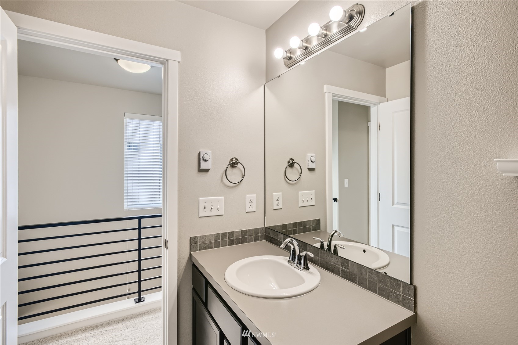 729 112th Street Southwest, Unit G1 Everett, WA 98204 - Photo 23 of 27 a bathroom with a sink and a mirror