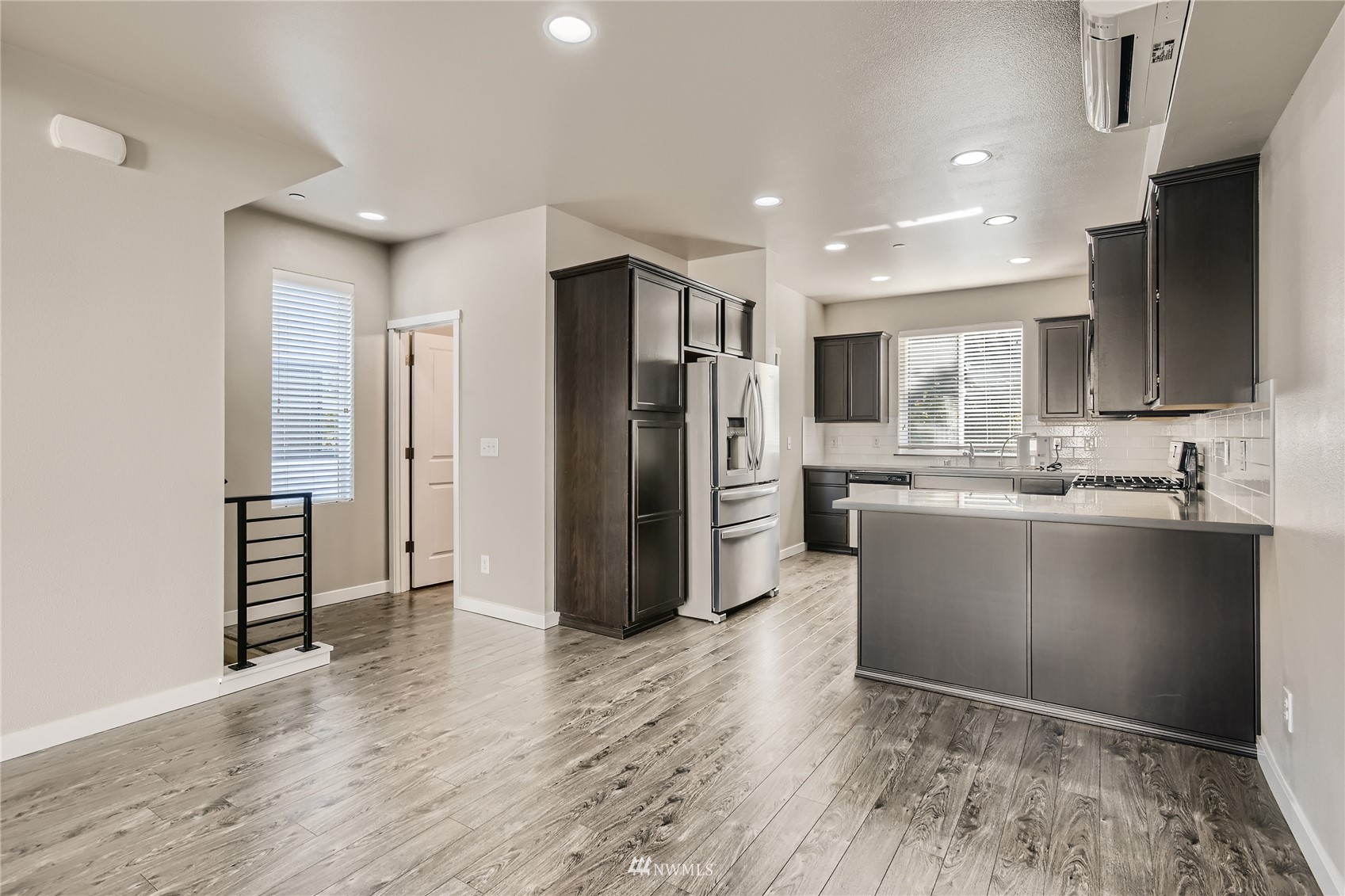 729 112th Street Southwest, Unit G1 Everett, WA 98204 - Photo 5 of 27 a kitchen with stainless steel appliances granite countertop a refrigerator and a stove top oven