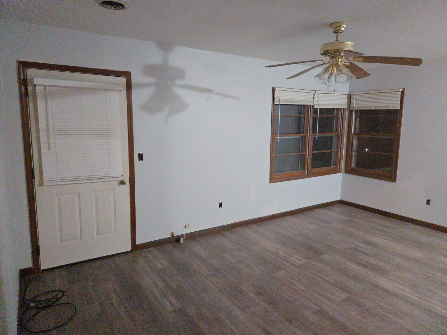 607 West Bluff Street Marseilles, IL 61341 - Photo 3 of 8 a view of empty room with wooden floor and fan