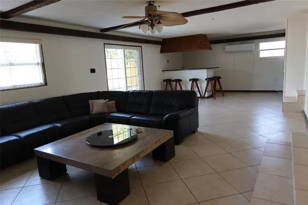 a living room with furniture and window