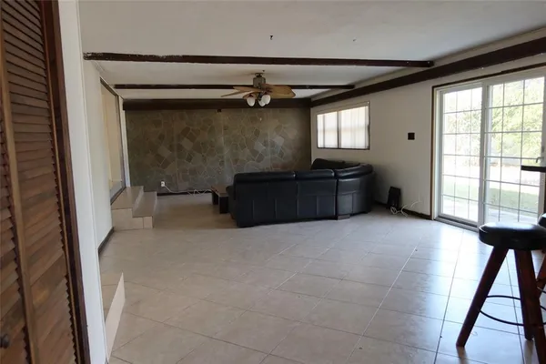a balcony with furniture and window