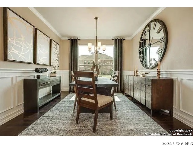 119 Aberdeen Boerne, TX 78015 - Photo 4 of 10 a dining room with furniture a chandelier and wooden floor