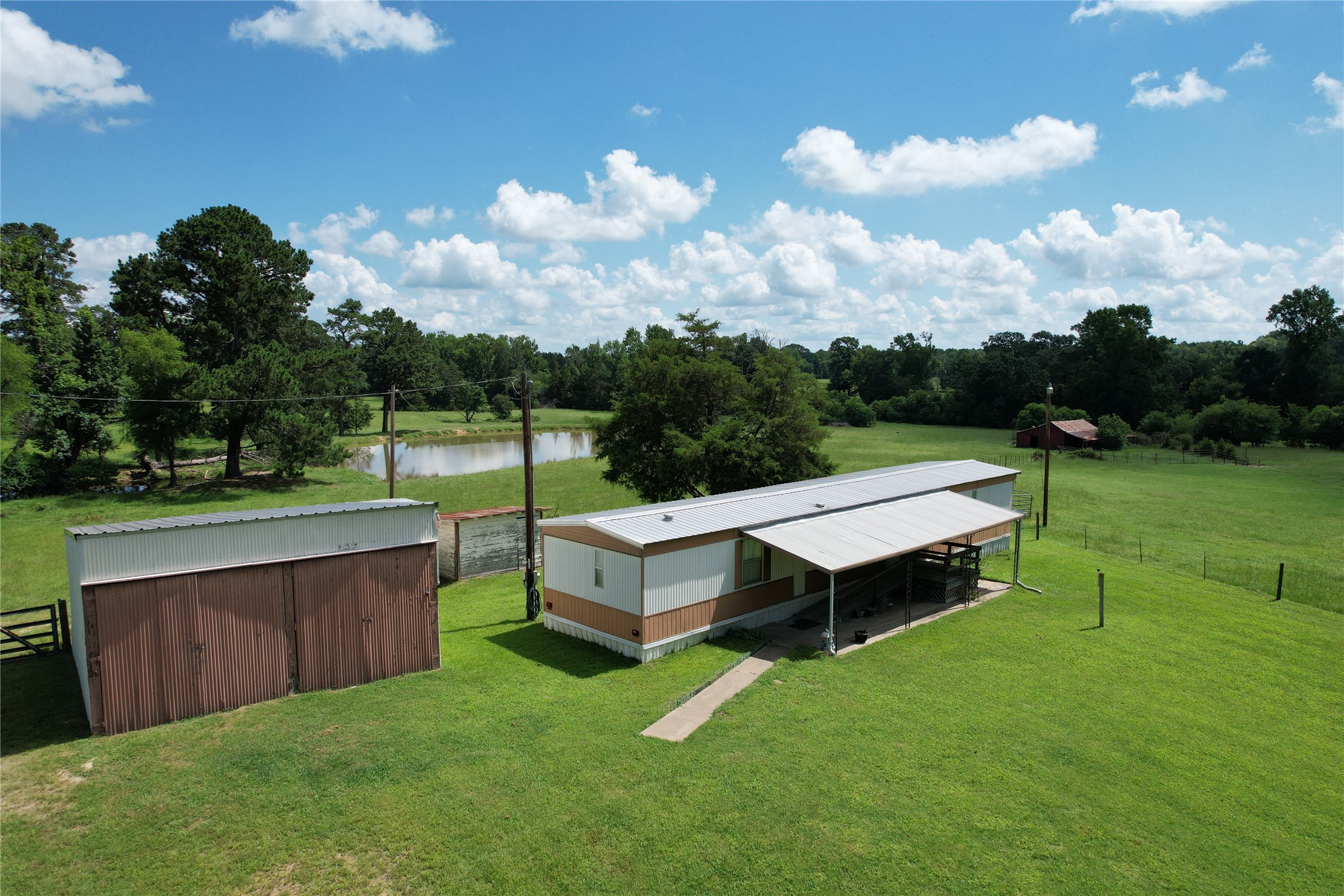 219 An County Road 185 Elkhart, TX 75839 - Photo 22 of 36 a view of a patio with chairs and a yard