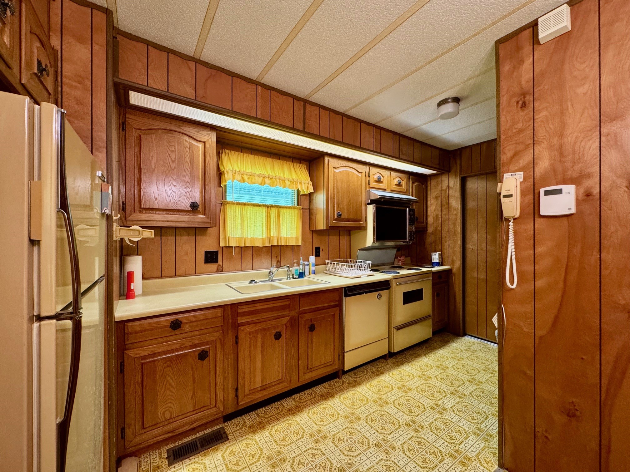 219 An County Road 185 Elkhart, TX 75839 - Photo 25 of 36 a large kitchen with stainless steel appliances granite countertop a refrigerator and a sink