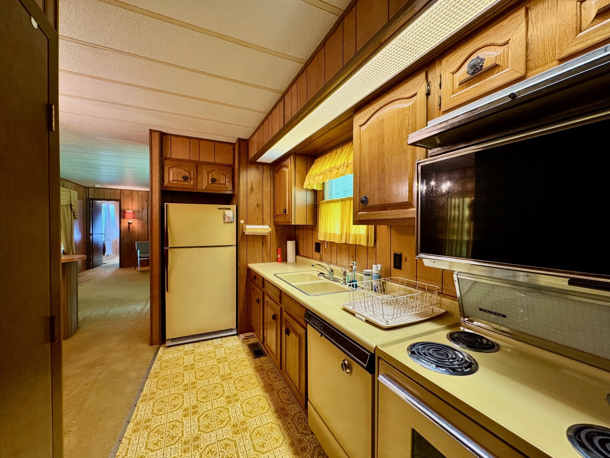 219 An County Road 185 Elkhart, TX 75839 - Photo 26 of 36 a kitchen with a stove and a refrigerator
