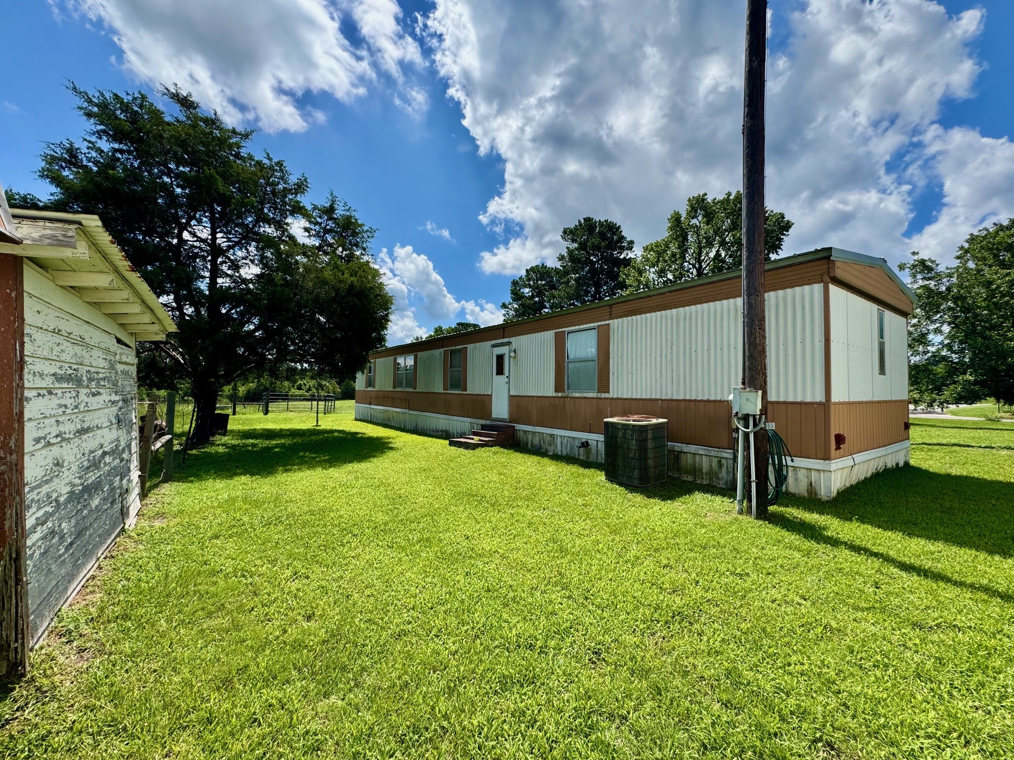 219 An County Road 185 Elkhart, TX 75839 - Photo 33 of 36 a view of backyard with a garden and trees